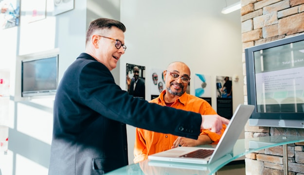 Sales team using Visla to convert a product brochure PDF into an explainer video on a laptop
